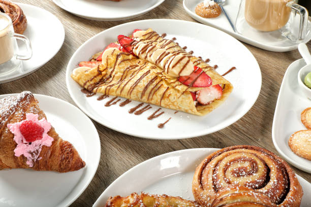 Group of sweet food plates on wooden table