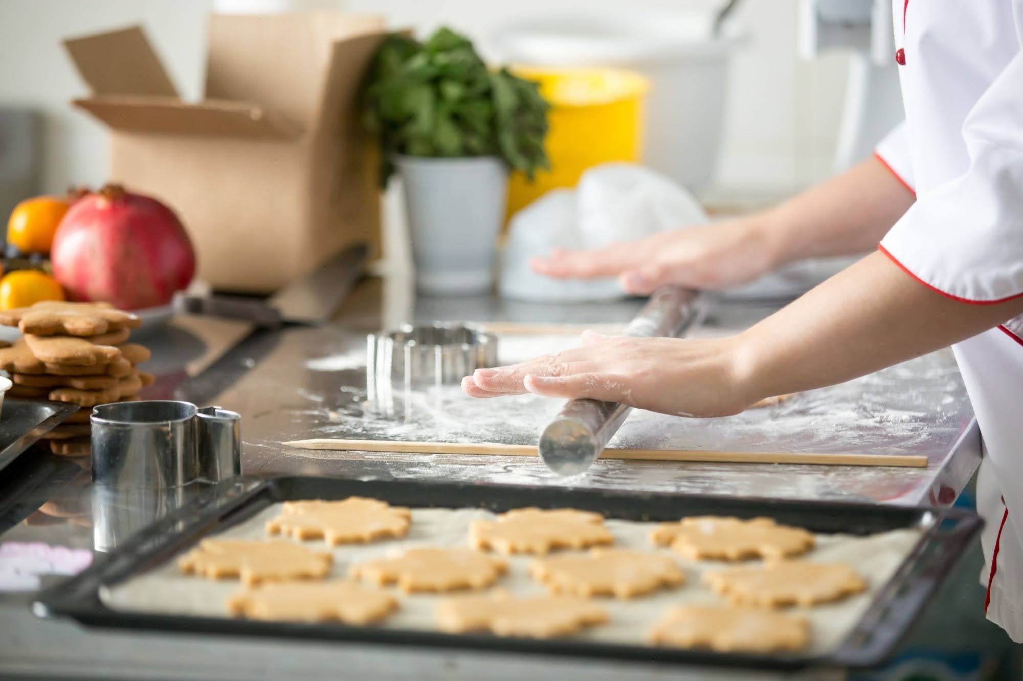 a chef rolling dough