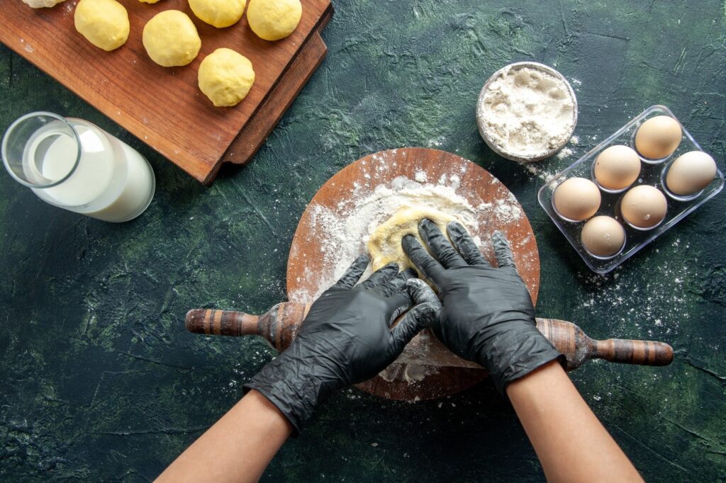a man rolling dough
