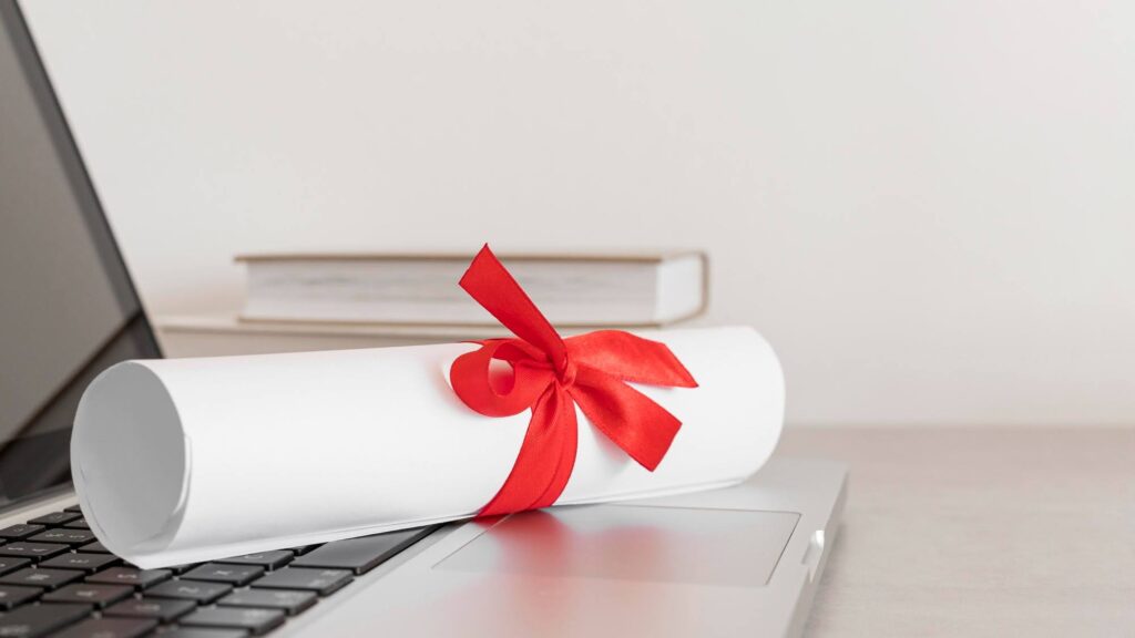 a scroll with a red ribbon