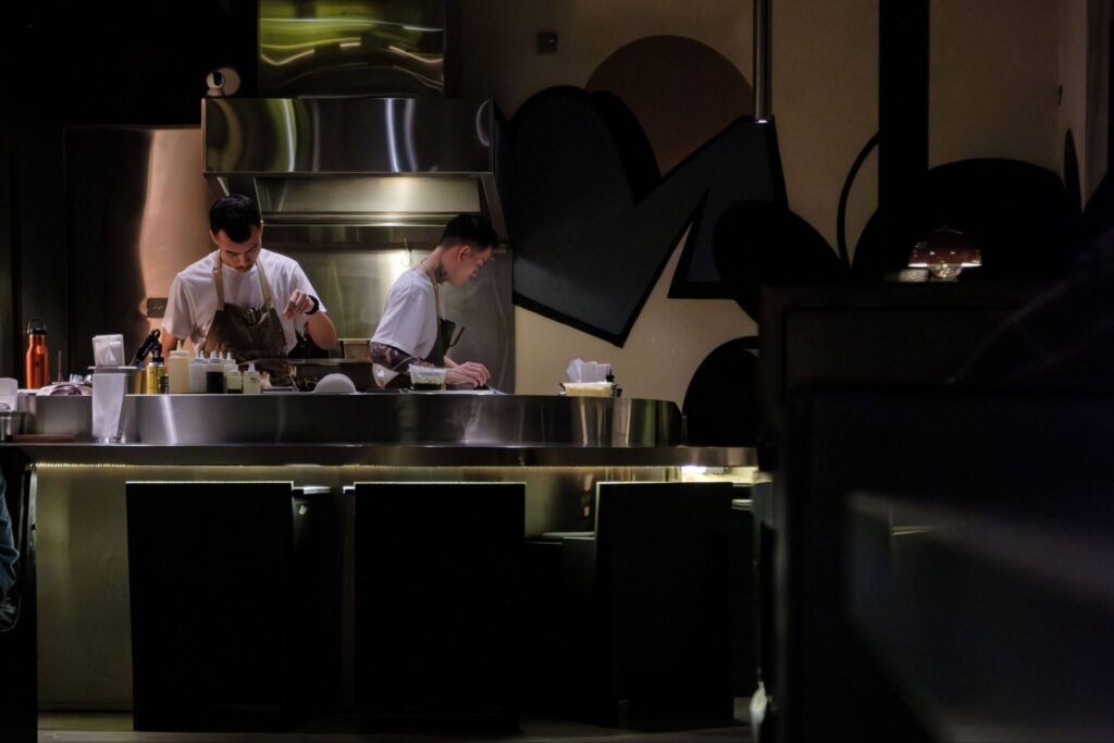 2 chefs cooking meals
