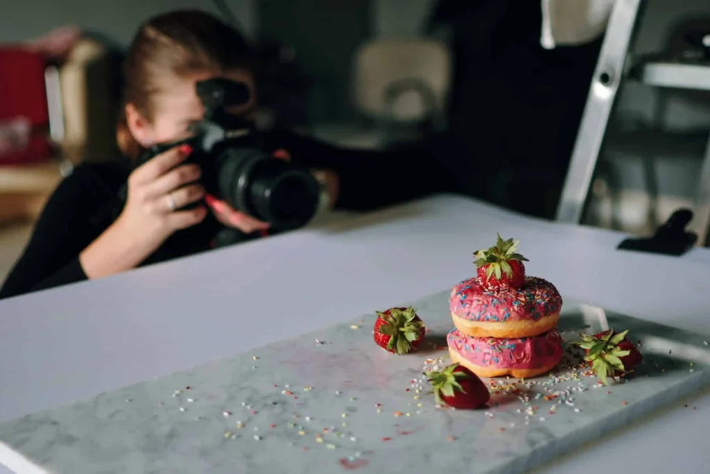person photographing food